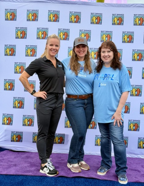 Strive employees at an event