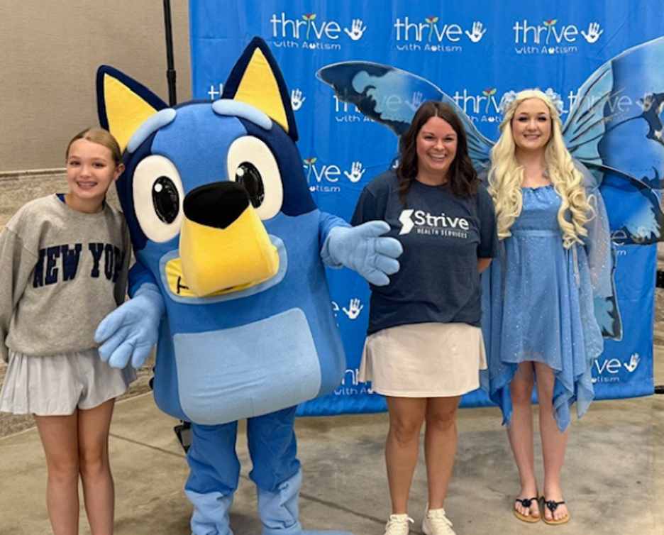 Strive employees at an event with popular children's characters