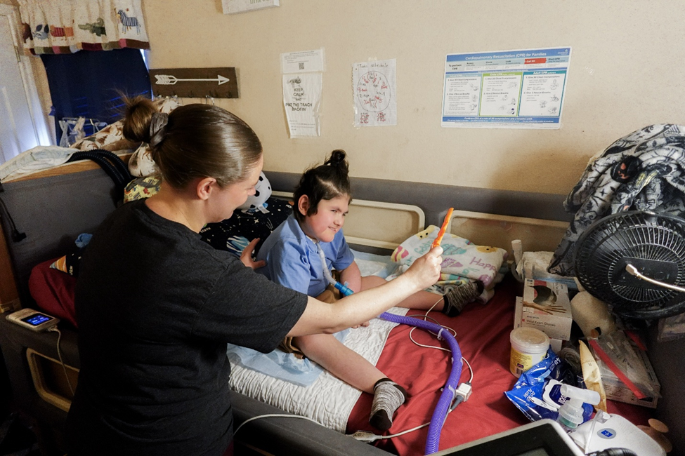 Nurse assisting adult patient